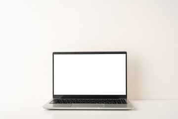 Fototapeta premium A side view simple and elegant laptop on a minimalist desk, reflecting a Scandinavian design style. Perfect for modern workplaces and creative spaces, highlighting simplicity and functionality