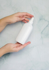 Woman hand showing cream product. Female hands holding cosmetic product branding mockup.Close up.