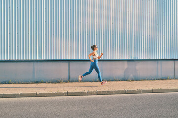 Woman Runner Jogging on the Street. Urban Fitness, Street Joggin