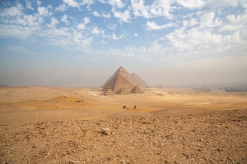 Egypt. Cairo - Giza. General view of pyramids from the Giza Plateau (three pyramids known as Queens' Pyramids on front side; next in order from left: the Pyramid of Menkaure, Khafre and Chufu