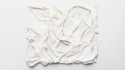 Obraz premium A top view of a crumpled white fabric on a flat surface, showcasing texture and folds.