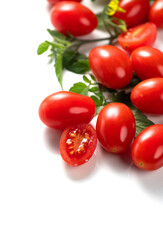 Tomato. Cherry tomatoes Fresh Ripe natural little tomatoes close-up. Organic tomato with leaves isolated on white background. Vertical. Garden, Gardening concept. Ketchup, pasta, sauce ingredient 