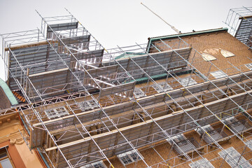 Old style brick building under construction.