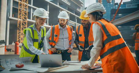 Portrait of Diverse Multiethnic Team of Construction Workers Having a Meeting Outdoors at a...