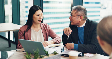 Business people, laptop and collaboration in office for feedback, discussion and company financial review. Japan, tech and executive meeting for investment proposal, teamwork and project planning