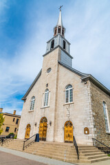 Fototapeta premium A view towards the church of Saint Alfonso in the bay at Saguenay, Quebec in Canada in the fall
