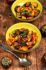 Delicious vegetable stew in a bowl on the table.