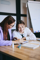 Obraz premium Schoolgirl and teacher have a lesson in the office, private lessons, distance learning