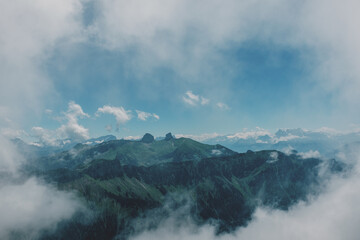 Fototapeta premium Alpine peaks in clouds