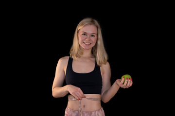 Smiling Fit Girl Measuring Waist and Holding Green Apple