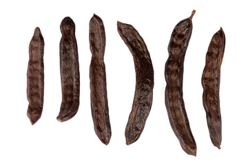 Carob fruit isolated on white background. Scientific name; Ceratonia siliqua