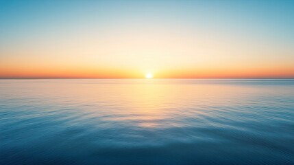 Obraz premium Serene Sunrise Over Calm Ocean Waters with Soft Colors