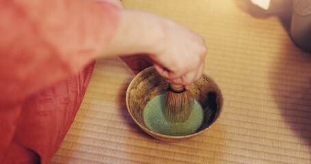 Hands, Japanese and green tea as ceremony for culture, heritage and respect as traditional beverage. Person, matcha and powder with drink, preparation and hospitality for practice or welcome in home