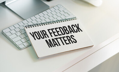 Text your feedback matters on white paper background business concept.