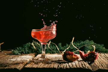 red cocktail splashing festive fizzy drink
