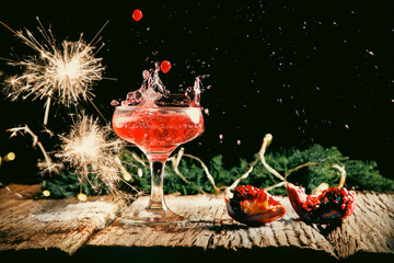 red cocktail splashing festive fizzy drink