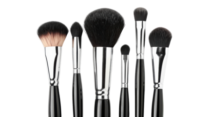 A set of six professional makeup brushes arranged elegantly on a clean white surface ready for beauty application or artistry work.