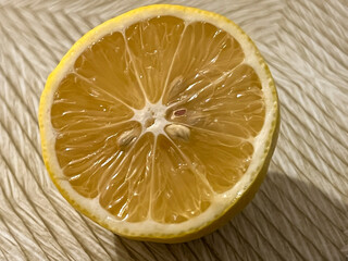 Close-up of a cut lemon lying on the table