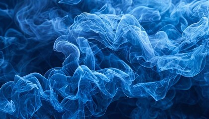 Fototapeta premium Vibrant blue smoke swirling against a black background creates a mesmerizing and abstract artistic effect, perfect for creative designs and digital backgrounds.