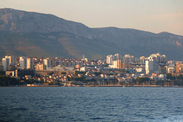 Fototapeta premium Contemporary buildings, gardens and beaches at the waterfront in Split, Croatia. View of Split from the boat.