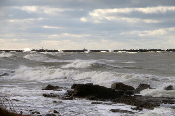 Stormy Baltic Sea with port piers in the distance, Europe, Latvia, Liepaja