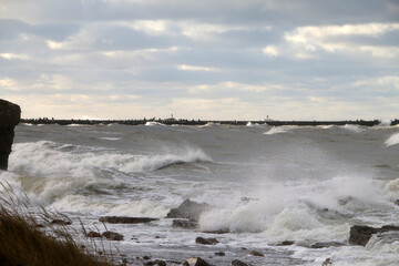 Stormy Baltic Sea with port piers in the distance, Europe, Latvia, Liepaja
