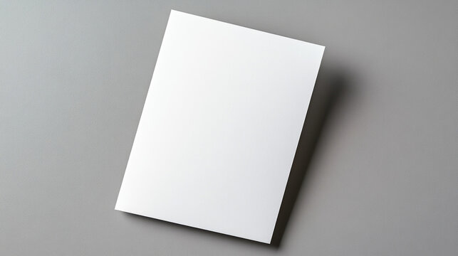 Open blank card on soft grey background, minimalist design, ample space for personalized messages, ideal for invitations or announcements