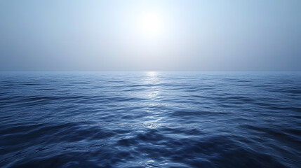 Obraz premium Serene ocean view under a hazy sky. Sunlight glistens on the calm water's surface, creating a tranquil and peaceful atmosphere. Perfect for backgrounds or travel themes.