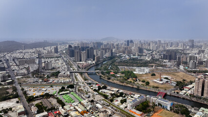 Fototapeta premium Aerial view of Kaohsiung showcasing urban development and riverscape in Taiwan