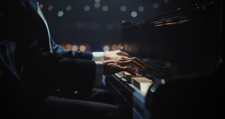 Close Up on Pianist Hands Playing a Mesmerizing Jazz Melody on a Black Grand Piano. Anonymous...