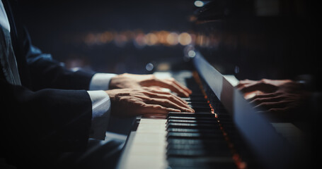 Close Up on Hands of a Talented Anonymous Pianist Making a Masterful Performance on a Grand Piano....