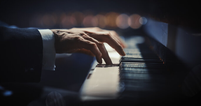 Close Up on Pianist Hands Playing a Mesmerizing Jazz Melody on a Black Grand Piano. Anonymous Artist is Focused on Creating Beautiful Instrumental Sonata as He Plays on Stage for the Audience