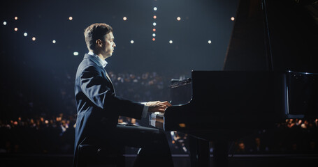 Virtuoso Music Artist Performing on Stage, His Hands Moving Effortlessly Over the Grand Piano....