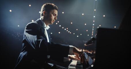 Male Pianist Sits Down at Black Grand Piano, Playing a Mesmerizing Jazz Melody. Audience Watching the Musician Play on Stage. Artist is Focused on Creating Beautiful Instrumental Sonata