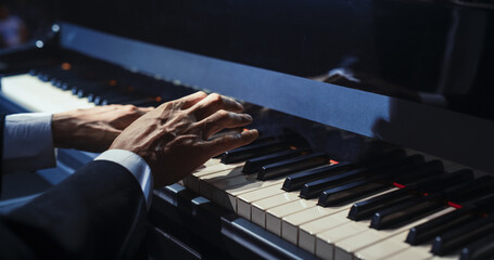 Close Up on Hands of a Talented Anonymous Pianist Making a Masterful Performance on a Grand Piano....