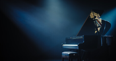 Black Grand Piano with a Microphone Standing on a Concert Stage Under Spotlights. Music Instrument...
