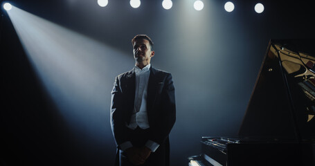 Pianist Stands Up After the Concert, Receiving Admiration From the Audience. He is Showing...