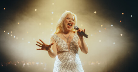 Blonde Rock Singer Making an Energetic Performance on a Big Concert Stage, Artist Delivers a...