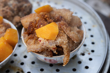 Steamed stuffed tofu in a bamboo basket