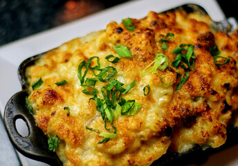 lobster mac and cheese served in a cast iron skillet