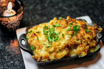 lobster mac and cheese topped with green onion