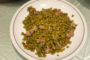The stir-fried pork with green beans in the plate