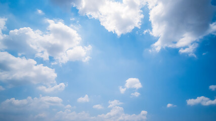 Obraz premium clear blue sky background,clouds with background, Blue sky background with tiny clouds. White fluffy clouds in the blue sky. 