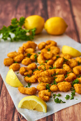 popcorn shrimp served with fresh parsley and lemon