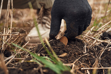 Close up view of man that found old coin on the field