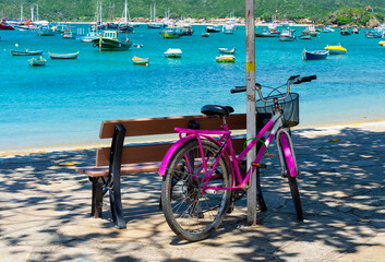 Cozy seafront with bicycle and bench in Buzios, Rio de Janeiro. Brazil. Cityscape of Armacao dos Buzios.
