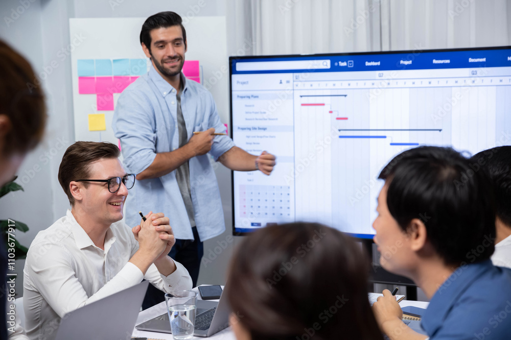 Leinwandbilder Project manager communicate and collaborate with team using project management software display on monitor, tracking progress of project task and making schedule plan at meeting table. Prudent