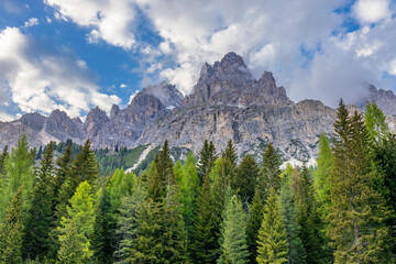 Dolomites mountains nasty weather in autumn with dark cloudy sky before the storm. Black clouds on the sky above the mountain rocky summits and peaks, stormy weather in the Dolomiti Alps, Italy. Extre