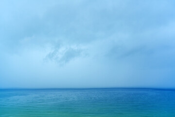 Downpour rain sea wall falling into the sea