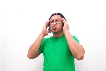 Asian man gesture who is feeling headache or migraine and vertigo isolated on white background